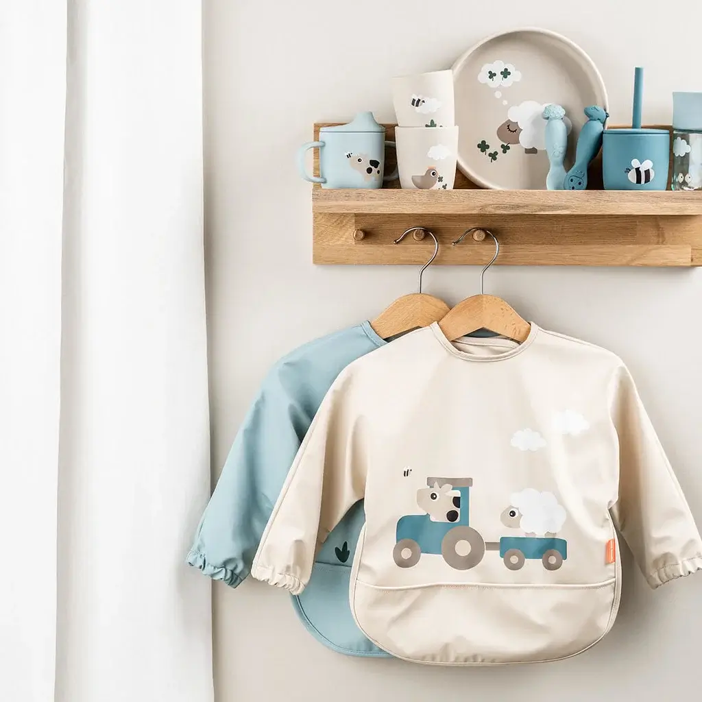 Babero con bolsillo y mangas Tiny Fram Sand